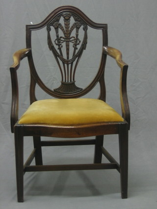 A 19th Century mahogany shield and feather back open arm carver chair, the seat of serpentine outline, raised on square tapering supports