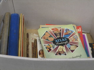 A collection of various children's annuals, books etc in a white cardboard box