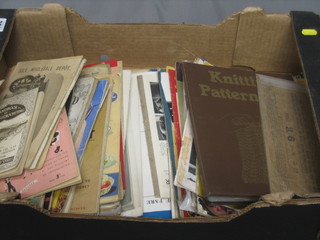 A cardboard box containing a collection of ephemera and paperwork relating to knitting etc