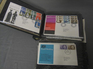 A green cardboard album of various first day covers and a small Yardley's cardboard box containing a collection of loose stamps