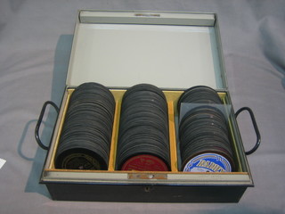 A black metal deed box containing a collection of 78rpm record centres