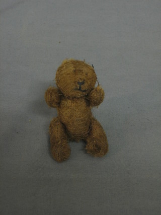 A miniature teddybear with articulated limbs 3"