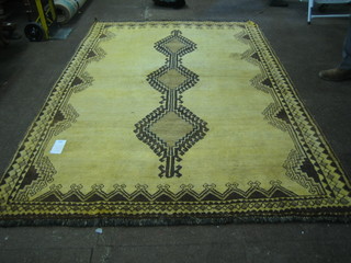 A tan ground Eyadi rug 91" x 67"