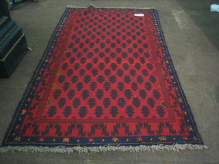 A contemporary red ground Belouch rug 75" x 41" 