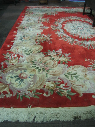 A red ground and floral patterned Chinese carpet (some moth) 147" x 110"