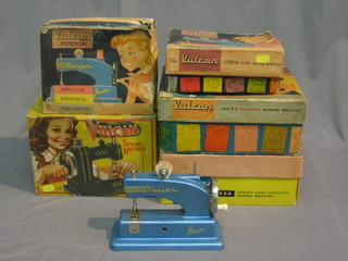 A childs Vulcan electric sewing machine, 2 Vulcan Junior sewing machines and 2 other Vulcan sewing machines (5), all boxed