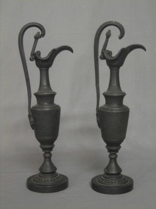 A pair of Victorian iron ewers 14" (1 handle f and r)