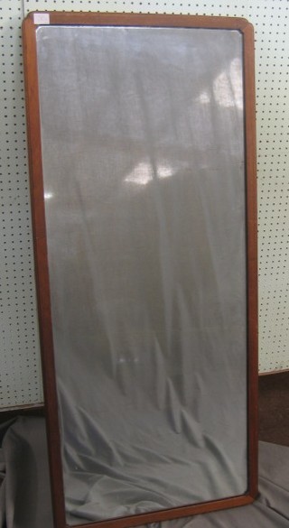 A rectangular plate wall mirror contained in an oak frame 48"