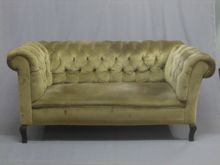 A Victorian mahogany drop arm Chesterfield upholstered in mushroom coloured buttoned back material 62"