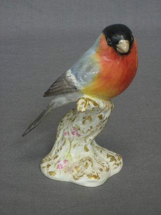 A Royal Worcester figure in the form of a seated bird, base marked 2662 4MC 6" high