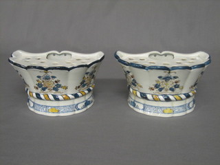 A pair of faience style wall bracket posy holders with floral decoration, the bases marked 5027 B&B (1 cracked) 7"