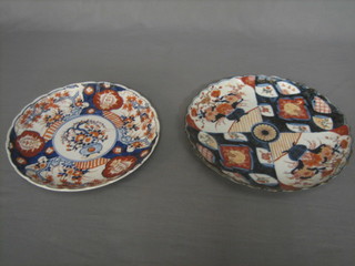 A 19th Century Japanese Imari porcelain plate with panel decoration and lobed border, 12" together with 1 other 11" (f and r)