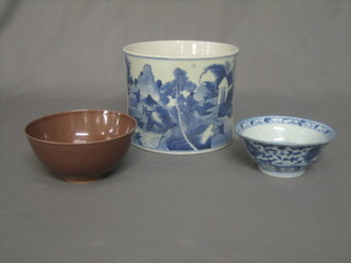 An Oriental blue and white circular jardiniere decorated landscape 6", a brown glazed bowl with 6 character mark to base 6 1/2" and a blue and white bowl with seal mark to base 6"