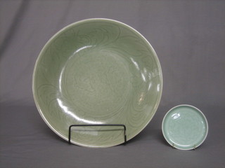 A Celadon bowl decorated fish, the reverse with 6 character mark 13" together with a small Celadon saucer, the reverse with small seal mark 4"