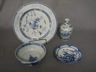 An Oriental blue and white charger 14" with floral decoration, an Oriental blue and white plate 8", do. bowl 8" (chip to rim) and a club shaped vase 9"