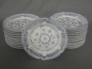 A set of 24 Continental blue and white ribbon ware porcelain plates 10"