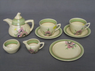 An Art Deco 8 piece Wilkinson Ltd tea service with green banding and floral decoration comprising teapot 4", tea plate 5 1/2", 2 cups and 2 saucers (1 cup chipped), milk jug 2", sugar bowl 1"
