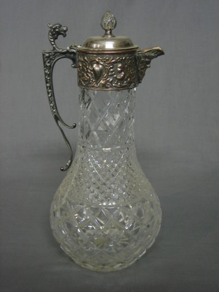A Victorian cut glass claret jug with silver plated mounts