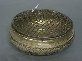 An Eastern circular embossed silver rose bowl, raised on 3 bun feet, 10 ozs