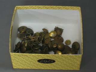 A collection of various military buttons and coins including Lancers, RAF, etc