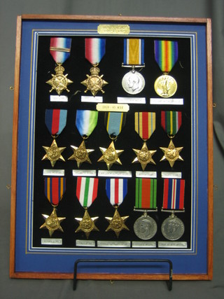 A display of 14 various First and Second World War British medals comprising 1914 Star with facsimile bar to 18386 Pte. E Adey Royal Army Medical Corps, 1914-15 Star to 886983 Gunner G Parrott Royal Field Artillery, British War medal to 184353 Driver T G Staines Royal Artillery, Victory medal to R5458 J D Jones Able Bodied Royal Naval Volunteer reserve, together with a 1939-45 Star, Atlantic Star, Facsimile Air Crew Europe, Africa Star, Pacific Star, Burma Star, Italy Star, France and Germany Star, British War medal and Victory medal, all mounted in a frame
