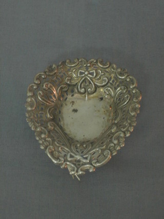 A Victorian pierced silver heart shaped dish raised on 3 bun feet, Birmingham 1878