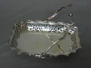 A rectangular pierced silver plated cake basket with swing handle