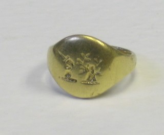 A lady's high carat gold signet ring with intaglio armorial decoration