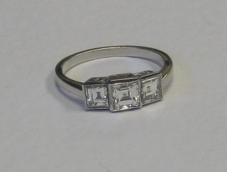 A lady's 18ct white gold engagement/dress ring set 4 Princess cut diamonds, approx. 1.25ct
