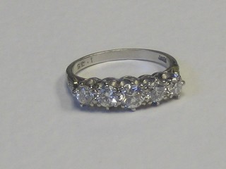 A lady's 18ct white gold engagement/dress ring set 5 diamonds and 6 diamonds to the shoulders, approx. 1.40ct