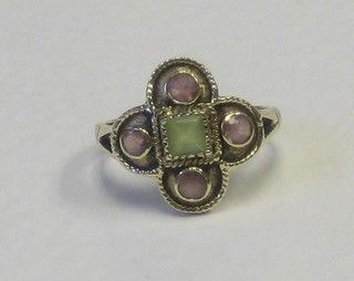 A lady's 9ct gold dress ring in the shape of a 4 leaf clover, set a central square cut peridot surrounded by 4 amethysts