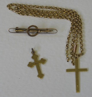 A 9ct gold Latin cross and a St James's gold cross hung on a belcher chain (f) and a gold bracelet