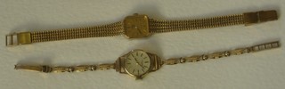 A lady's Rotary wristwatch contained in a 9ct gold case and 1 other