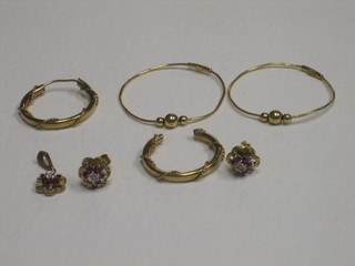 2 pairs of gold hoop earrings and 2 other gold earrings