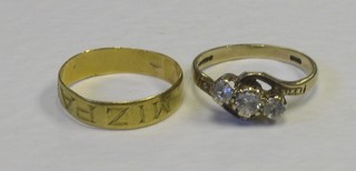 A 22ct gold wedding band and a 9ct gold dress ring set white stones