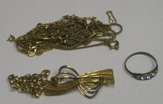 A gilt metal brooch and a small collection of "gold" chains