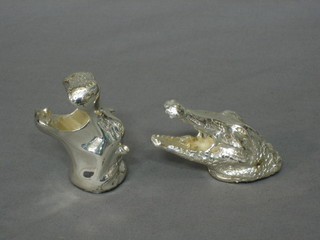 A silvered model of a rhino's mask 3" together with a do. crocodile