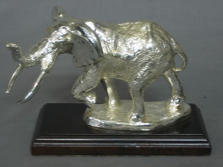 A silvered model of a walking Elephant 7"
