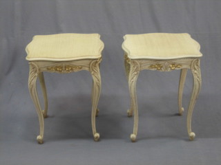A pair of Italian style shaped white wood lamp tables, raised on cabriole supports 18"