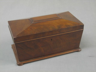 A Victorian mahogany sarcophagus shaped twin compartment tea caddy with hinged lid, raised on bun feet (mixing/sugar bowl missing) 12"