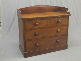 A Victorian mahogany wash stand with three-quarter gallery, the base fitted 2 short and 2 long drawers with tore handles, raised on a platform base 42"