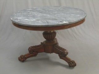 A circular Continental walnut Geradon table with grey veined marble top, raised on carved column and tripod supports 43"