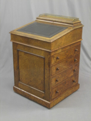 A Victorian figured walnut Davenport desk, the sliding top with stationery box and pierced brass three-quarter gallery, the pedestal fitted 4 long drawers 23"