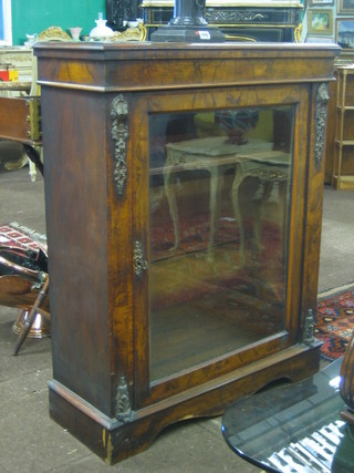 A Victorian walnut Pier cabinet fitted shelves, enclosed by a glazed panelled door, raised on a platform base 31"