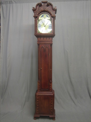 A 20th Century West German 8 day striking longcase clock with 11" gilt arch shaped dial with phases of the moon, contained in a mahogany case 84"