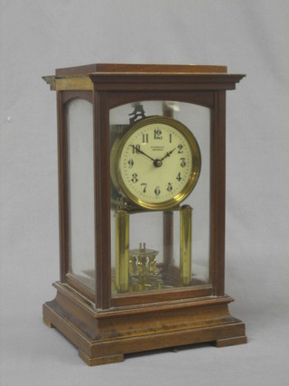 A 19th Century 400 day clock by Gustav Becker, the enamelled dial with Arabic numerals, signed S Fisher Ltd 188 Strand, contained in a walnut case