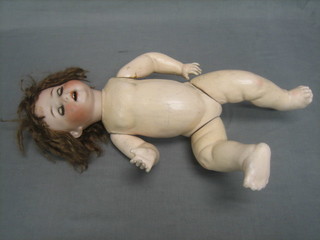 A 19th Century German porcelain doll with open and shutting eyes, open mouth with 2 teeth, the head impressed Heubach Koppelsdorf, marked 300.5 Germany