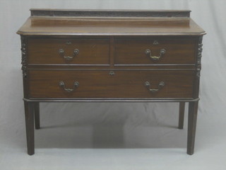 An Edwardian mahogany chest of 2 short and 1 long drawer, raised on tapering supports 45"