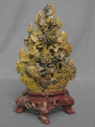 A carved and pierced soap stone ornament decorated birds, raised on a stand 17"