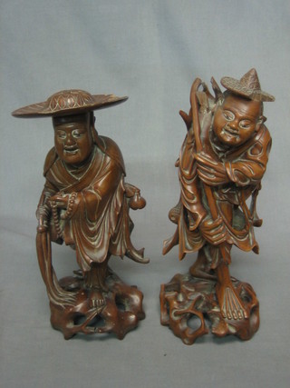 A pair of Eastern carved root figures 12"